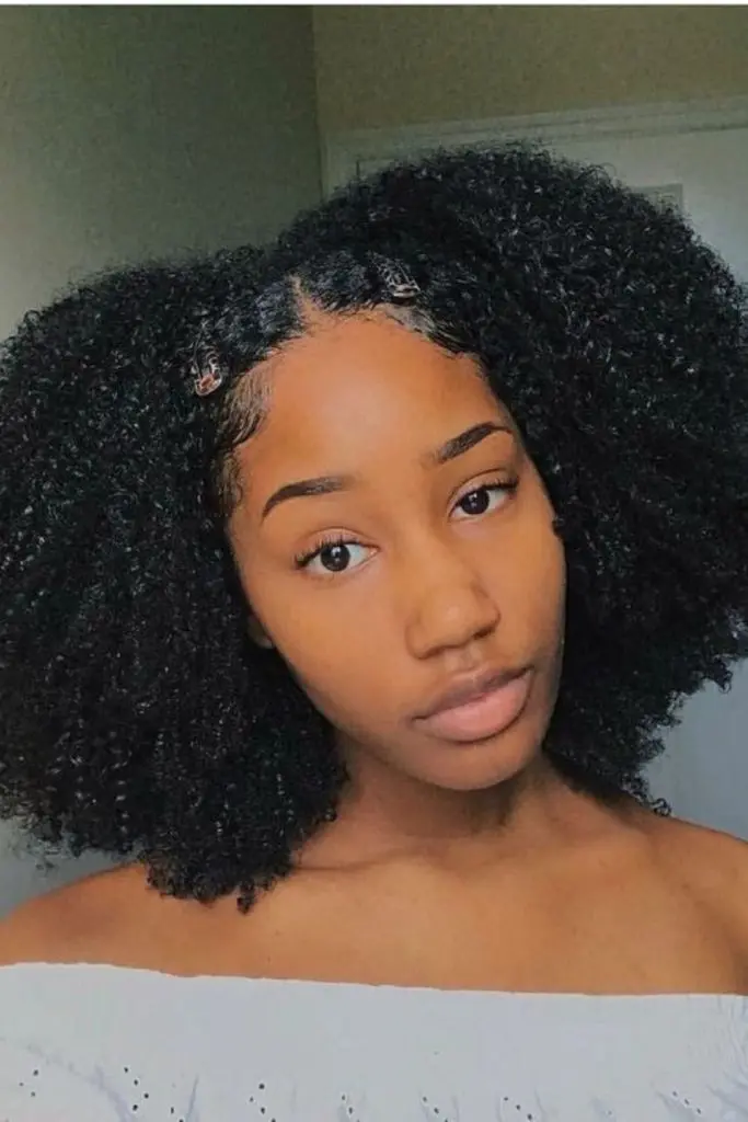 Playful afro puffs with bold, voluminous shape.