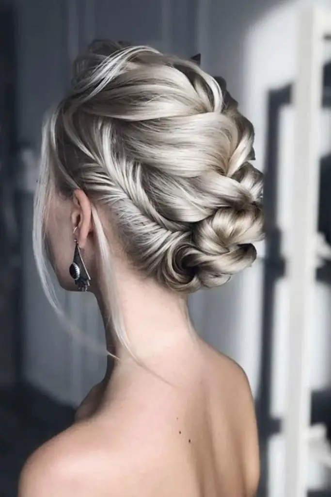 Elegant updo adorned with intricate braids.