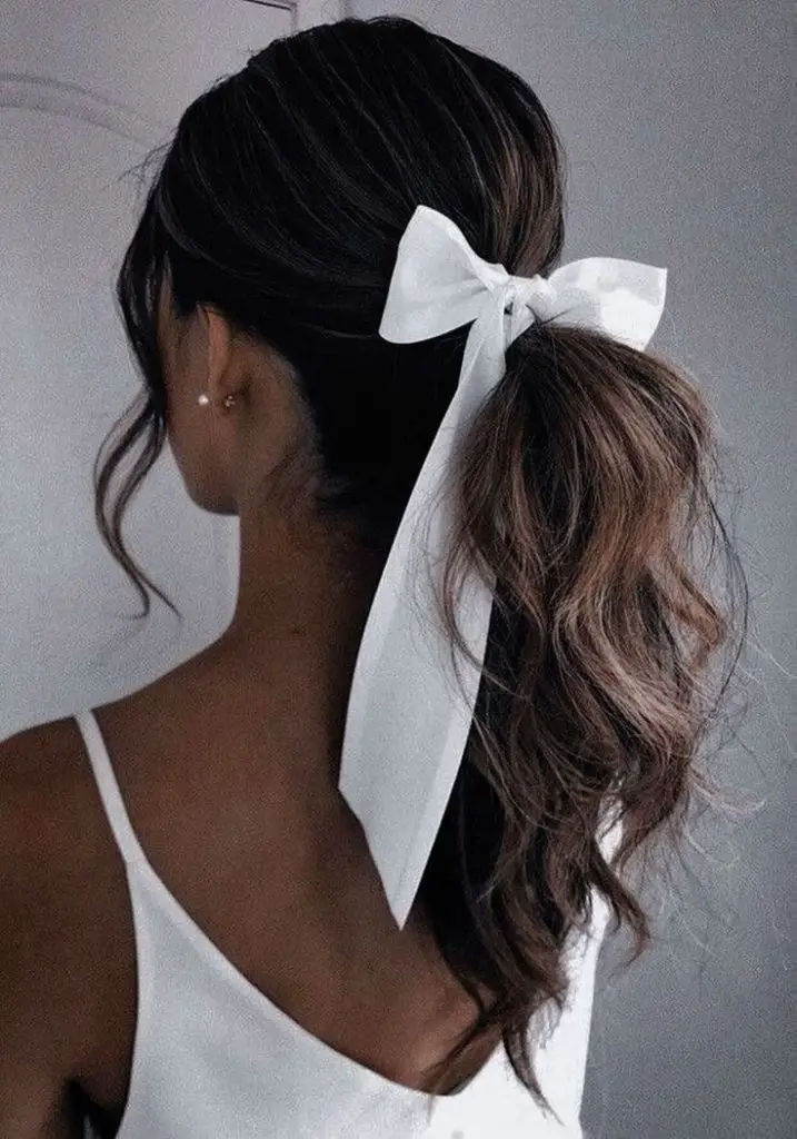 Sophisticated low ponytail with ribbon tie.