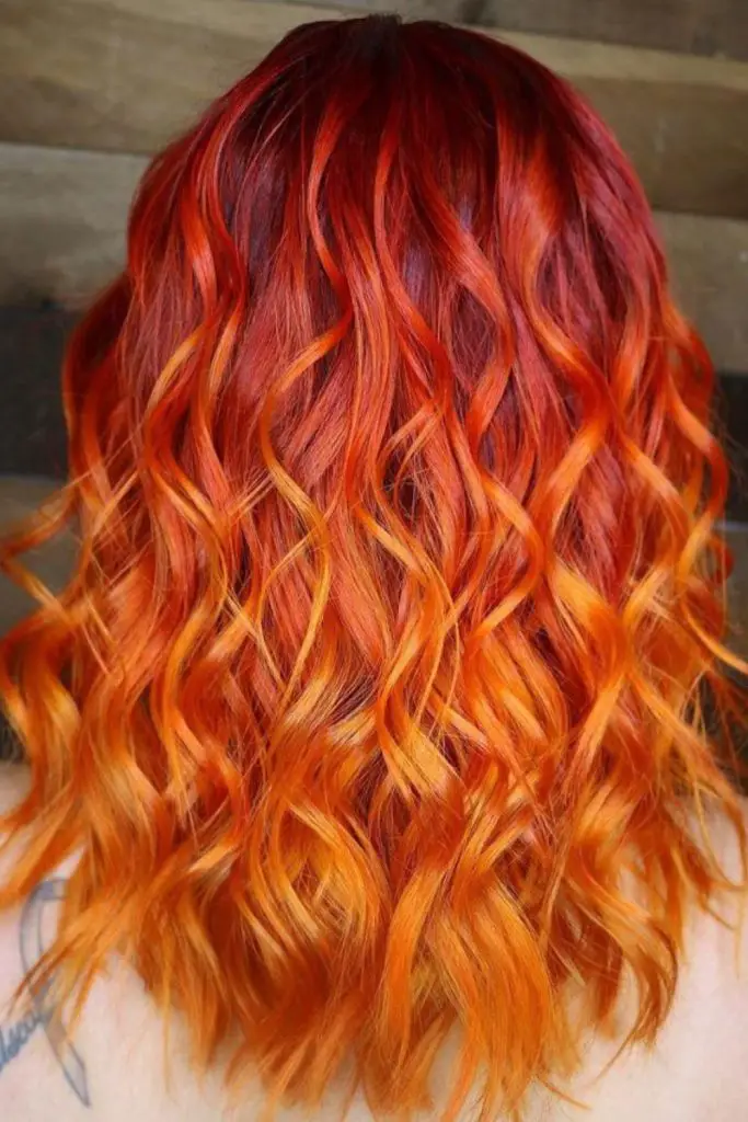 Bold copper highlights on deep auburn.
