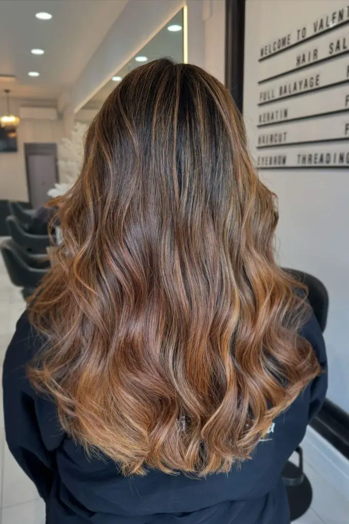 Shimmering caramel highlights for a luxe look.