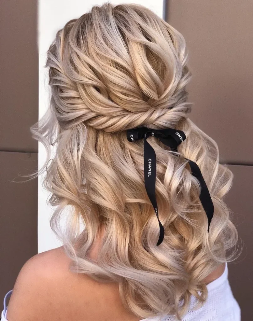 Effortlessly glamorous half-up bow twist for any occasion