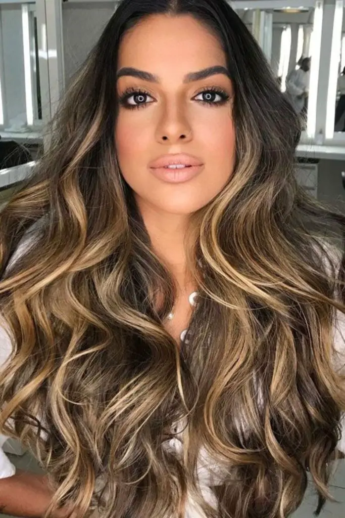 Warm caramel and hazel tones for depth.