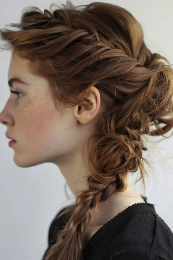 Relaxed side braid with bohemian flair.