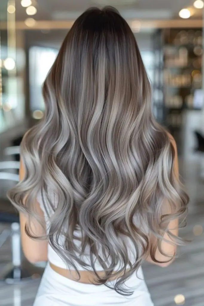 Moonbeam lowlights in ethereal silver hair.