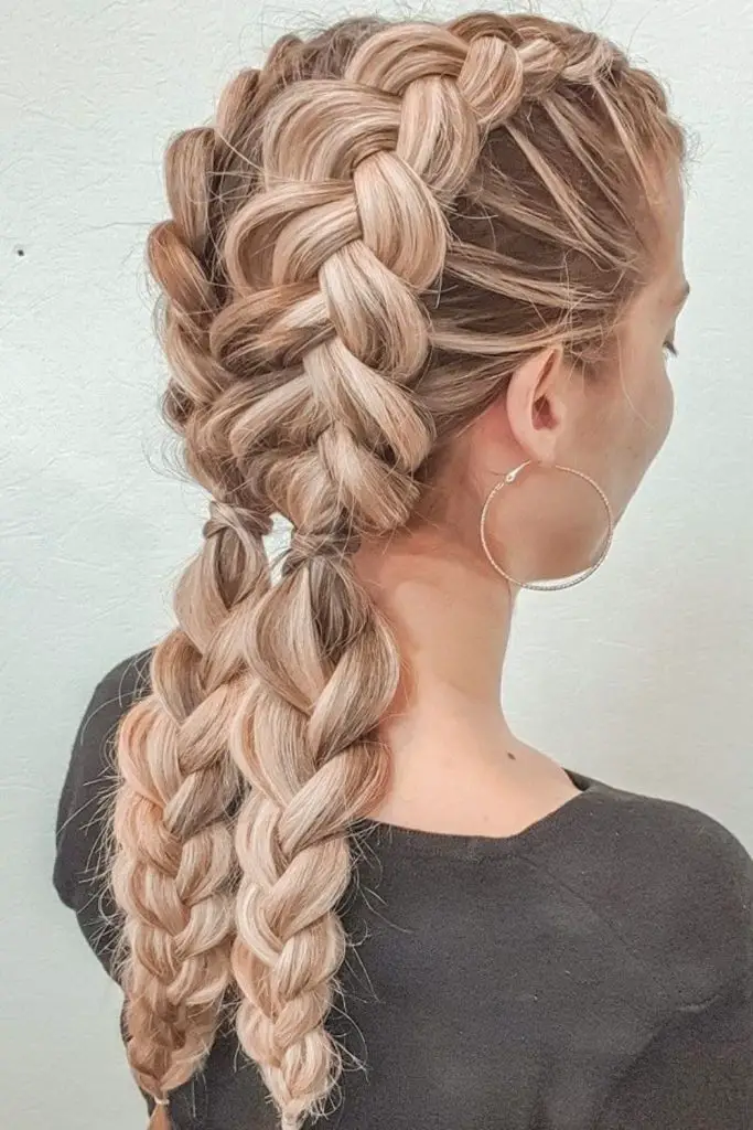 Playful pigtails exuding youthful charm effortlessly.