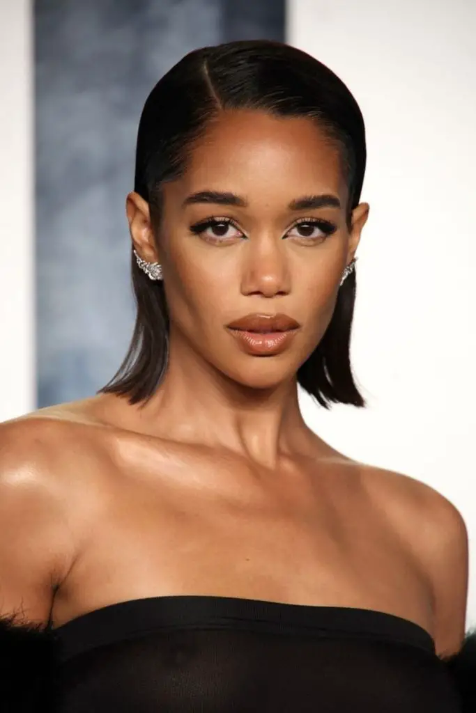 Sleek, smooth slicked-back short hair.