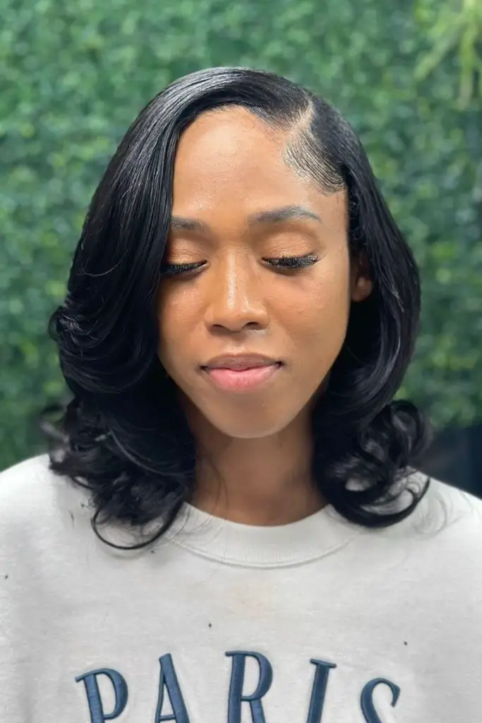 Side-swept pixie with smooth, silky texture.
