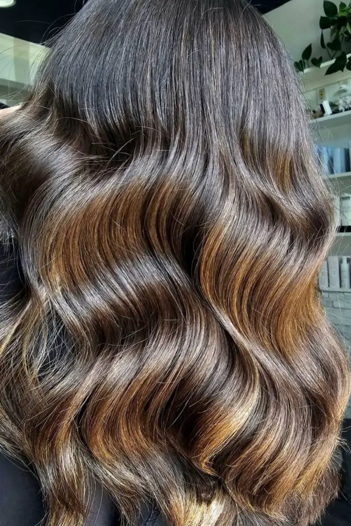Golden blonde highlights with caramel glow.