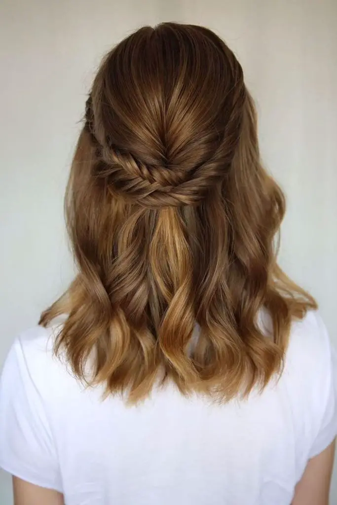 Elegant half-up twist with volume.