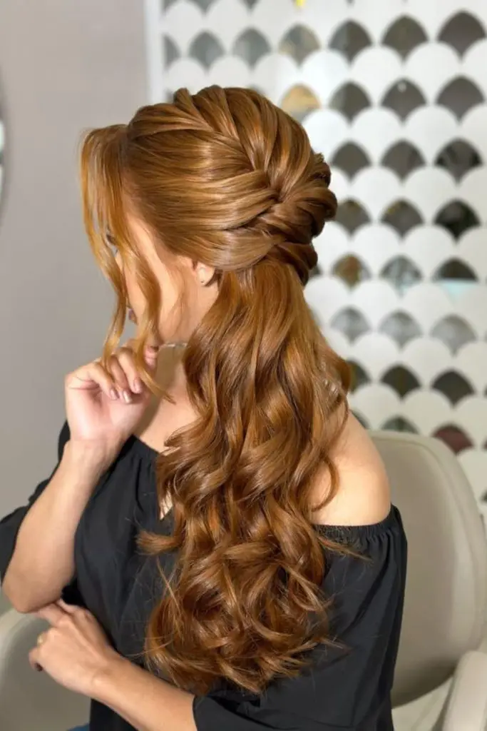 Effortless half-updo with twisted sections.