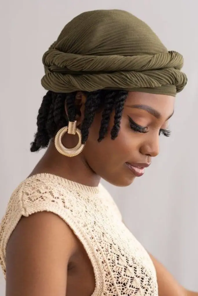 Scarf-wrapped locs adding chic bohemian flair.