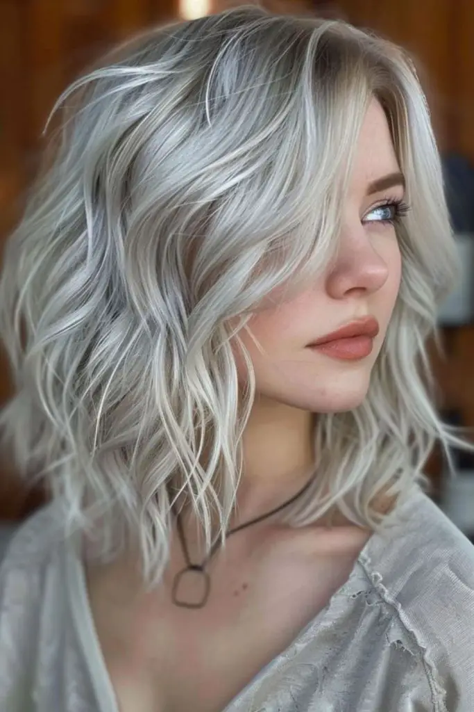 "Blonde hair with striking silver-white highlights."