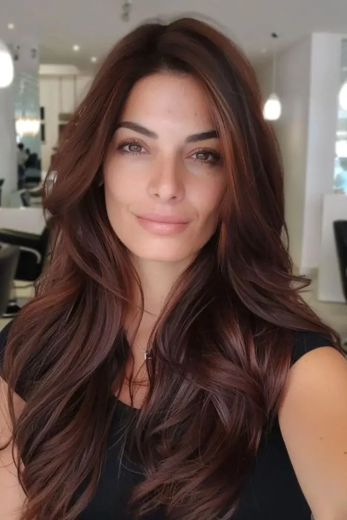 Spicy cinnamon tones on cocoa hair.
