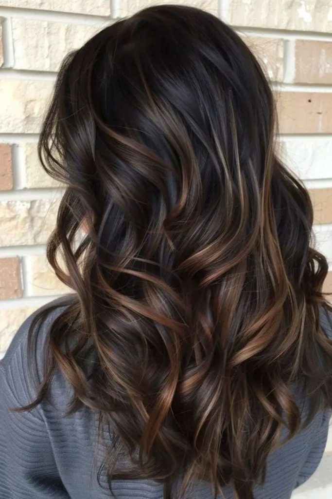 Warm cocoa balayage with cinnamon highlights.