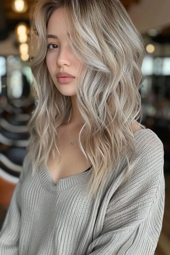 Smooth ombre transitioning from ash blonde.