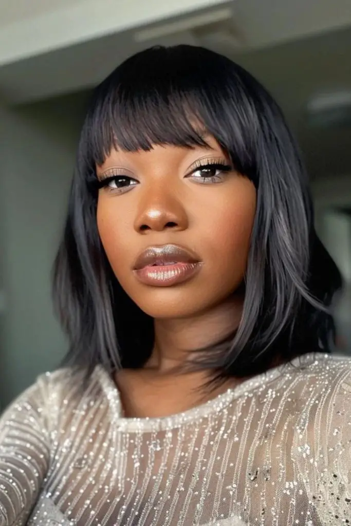 Glossy finish with bold blunt fringe.