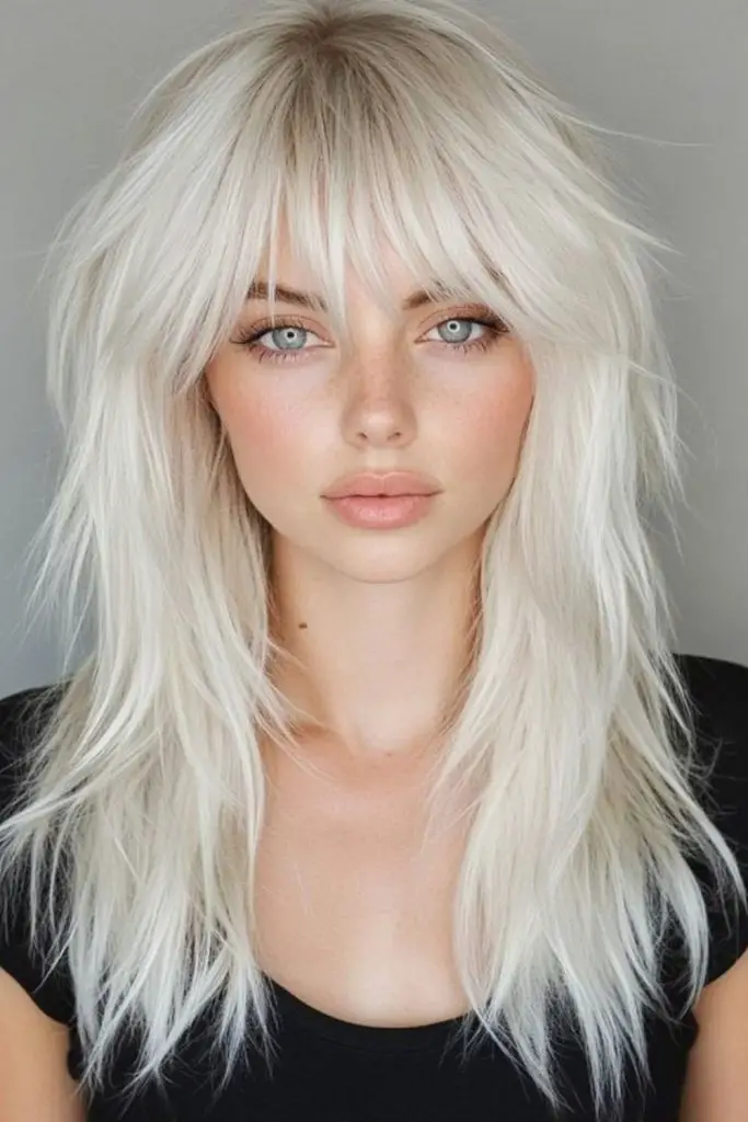 Soft curtain bangs in metallic blonde.