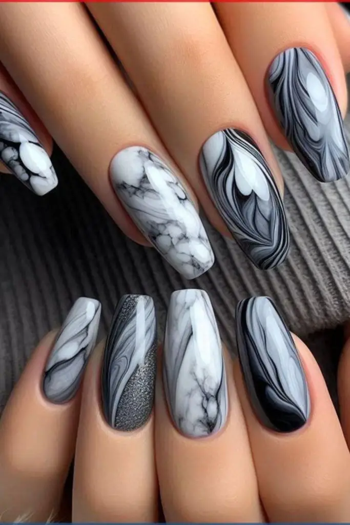 "Swirled marble nails in muted tones."