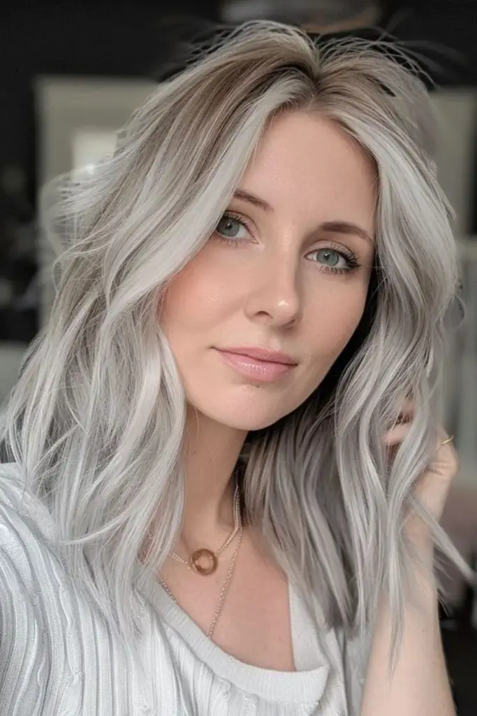 "Pale blonde with silvery grey streaks."