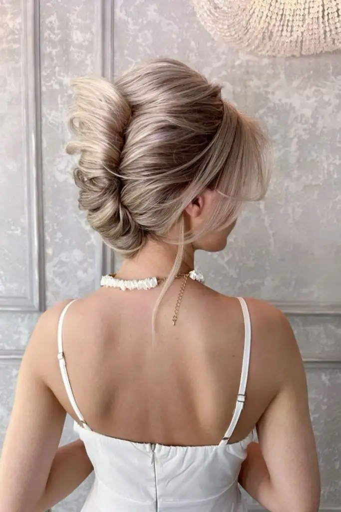 Elegant French twist with frosty hues.