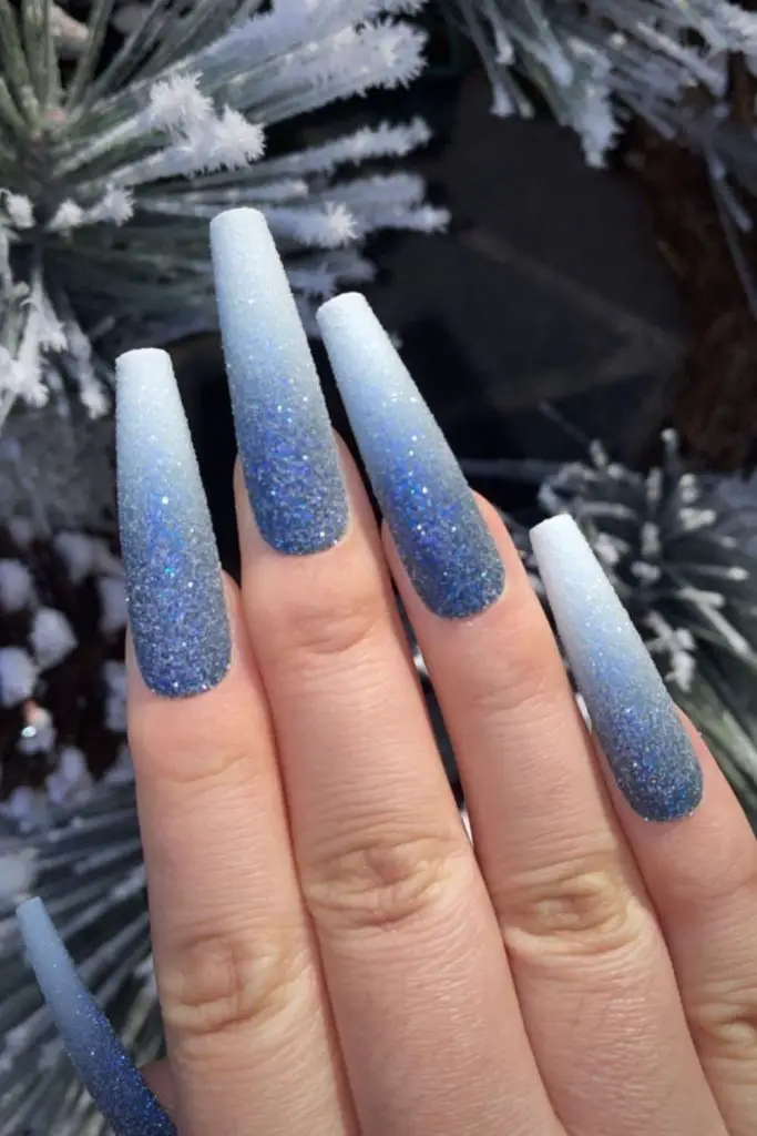 Icy blue nails with silver glitter.