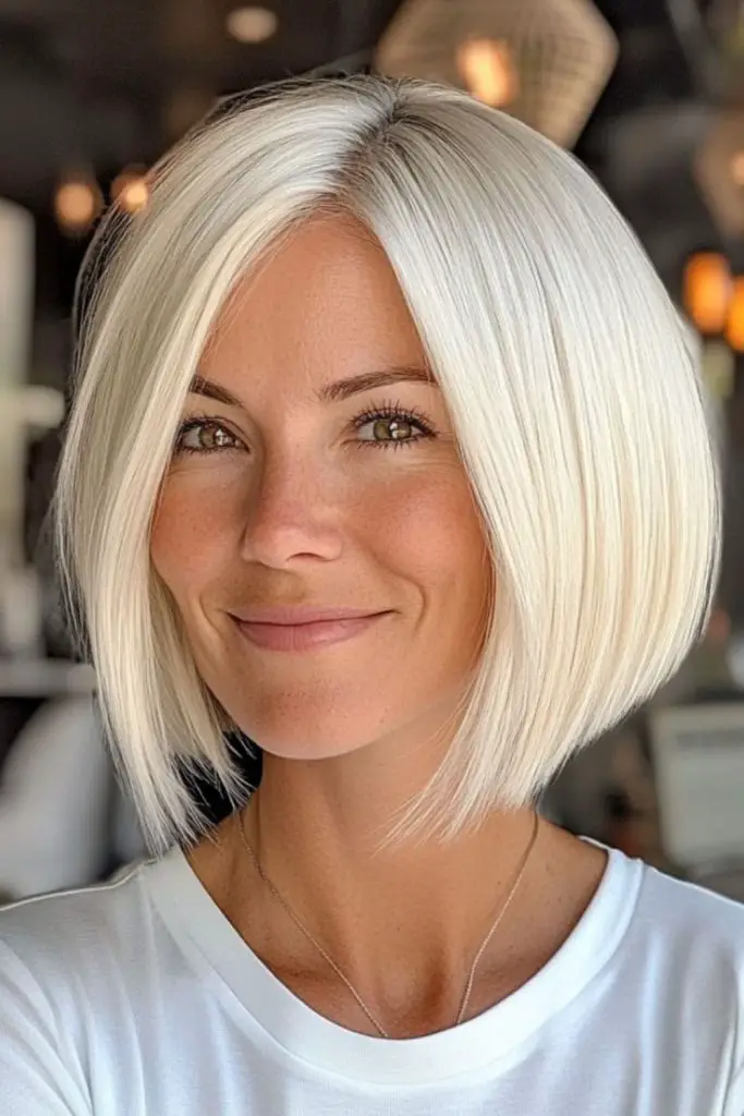 Sharp angled bob in silver-ice tones.