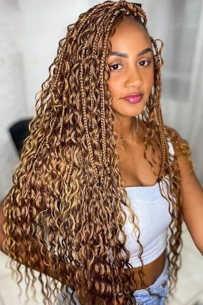 Braids blended with loose flowing curls.