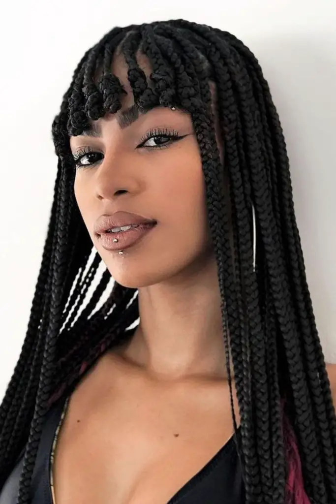 Braided bangs framing the face.