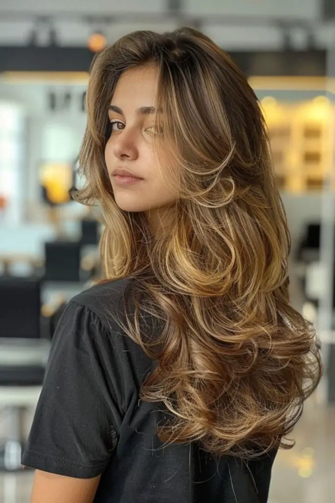 "Deep side part with feathered layered texture."