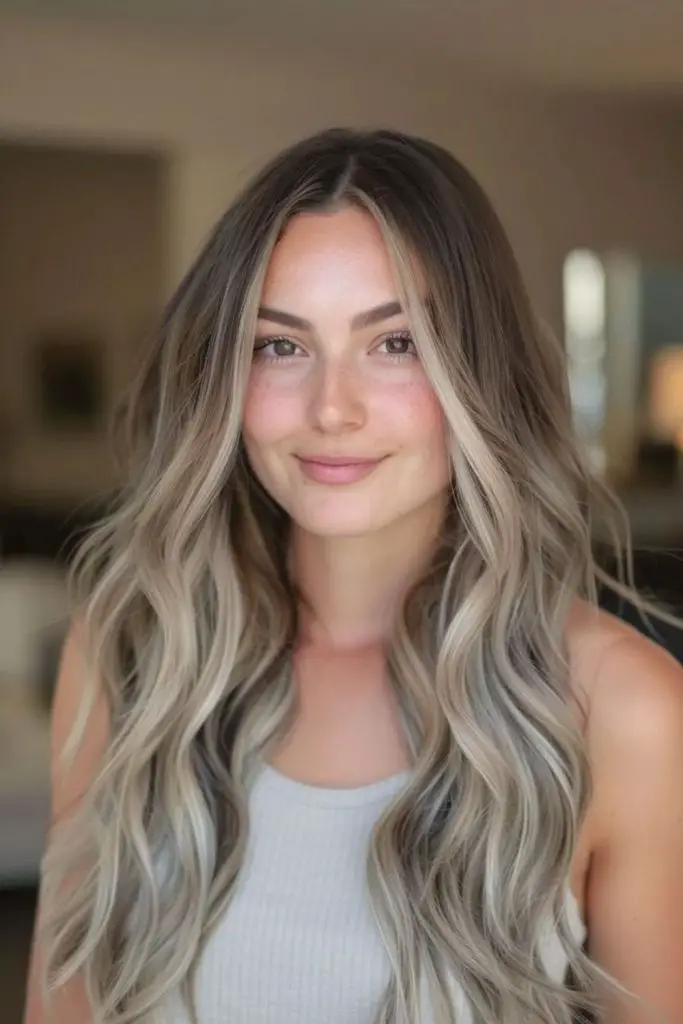 Frosted chestnut hair with beige highlights.