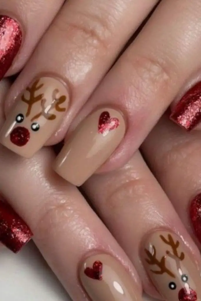 Nude nails featuring glitter antlers.
