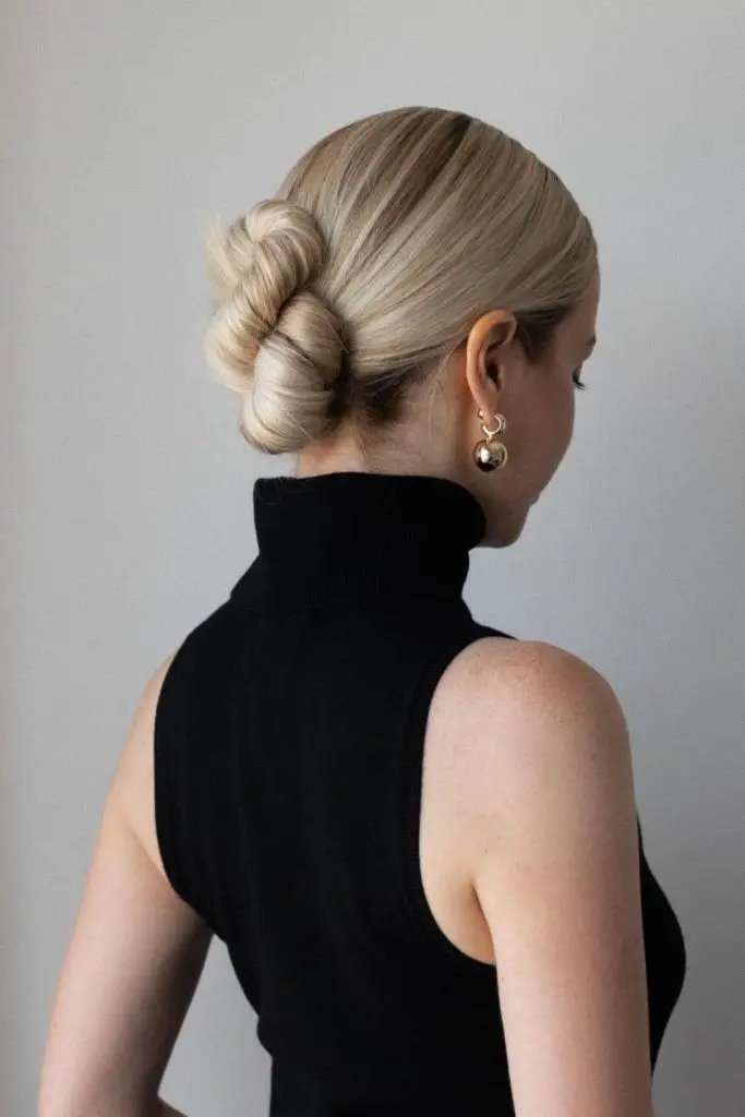 Elegant chignon perfect for knitwear.