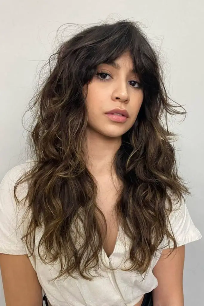 "Modern shag haircut with soft waves."