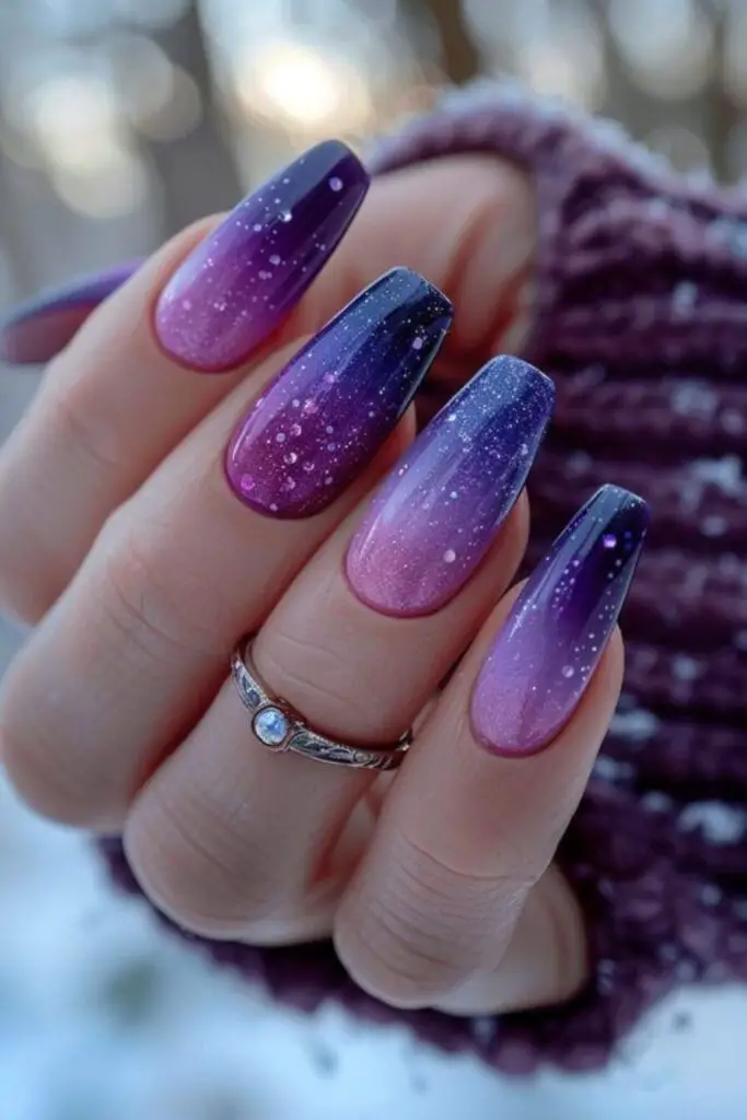 Lavender nails with rhinestone details.