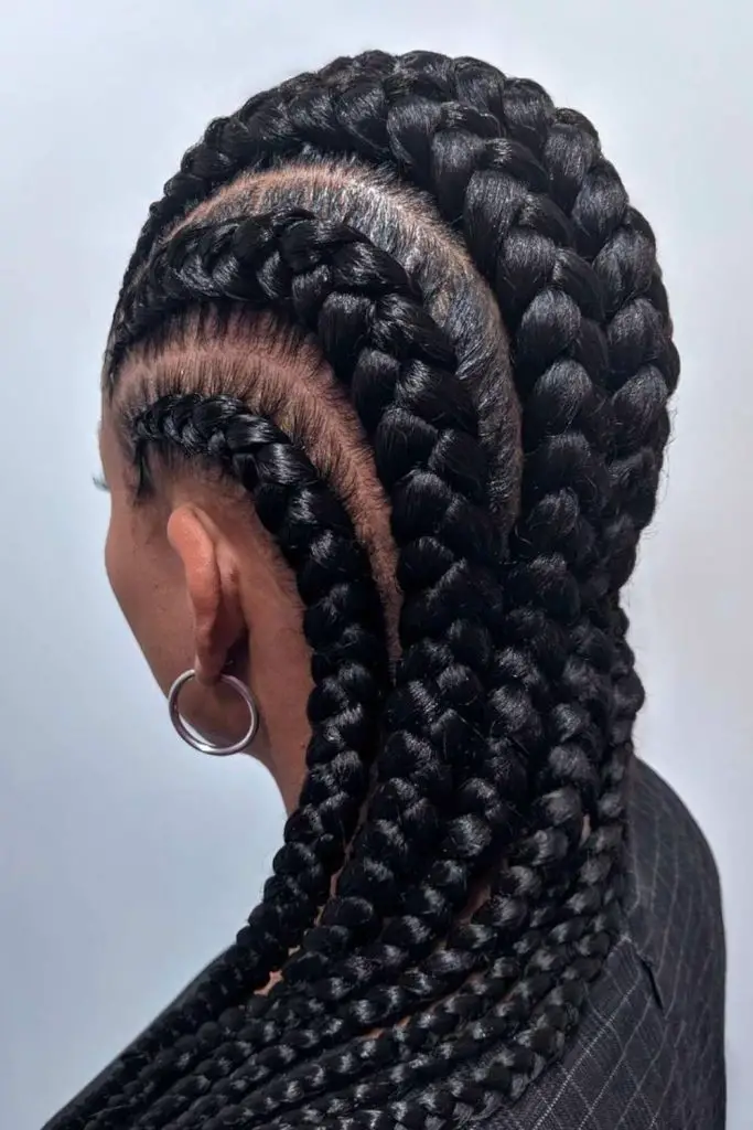 Edgy mohawk with bold braided rows.