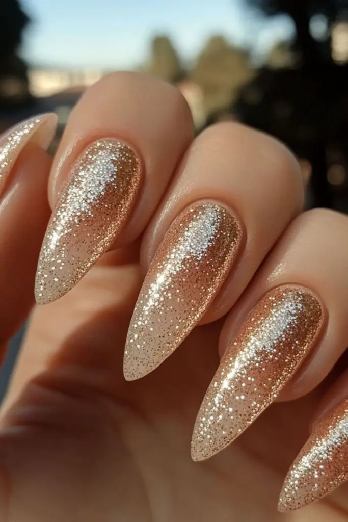 Champagne nails with pearlescent rhinestone elegance.