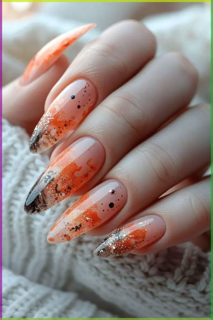 Coral nails with gold foil accents.