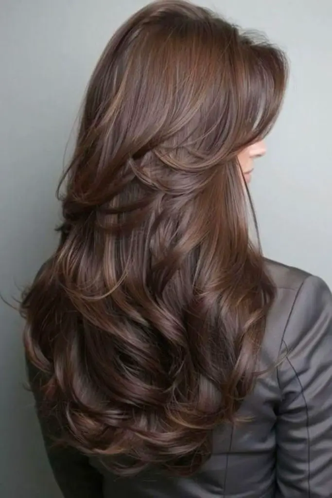 "Voluminous blowout with sleek silk press."
