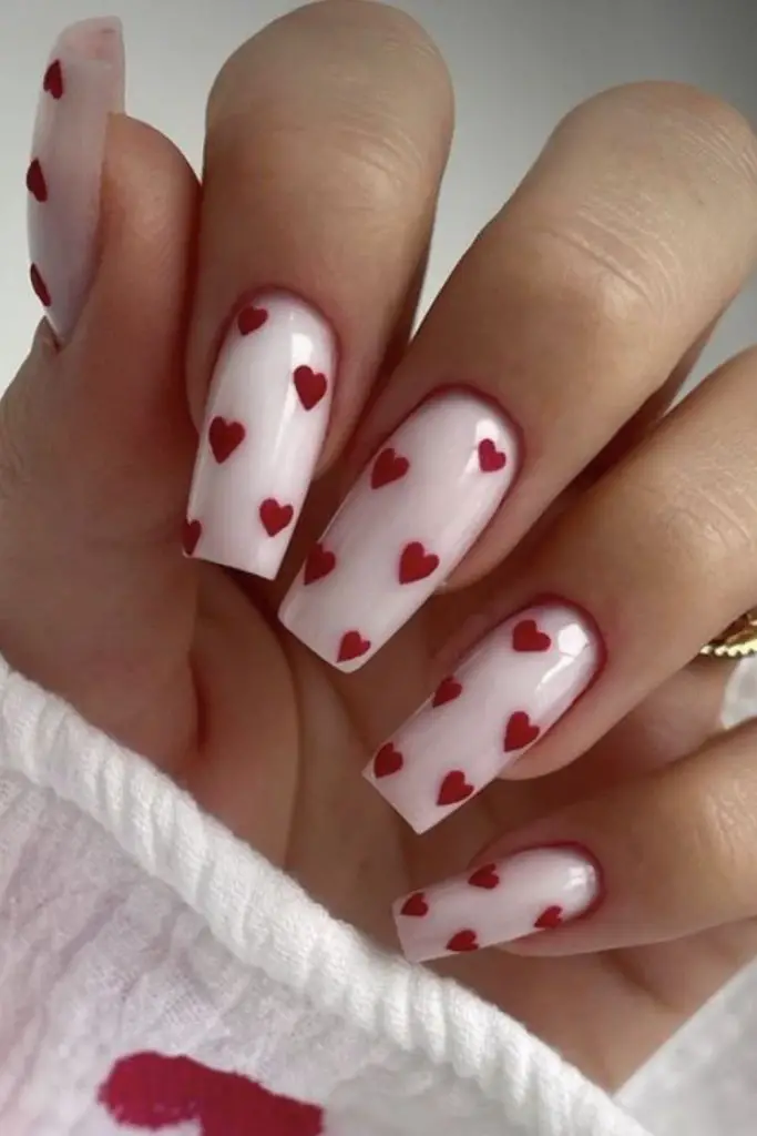 Transparent nails with subtle pink-red tints.