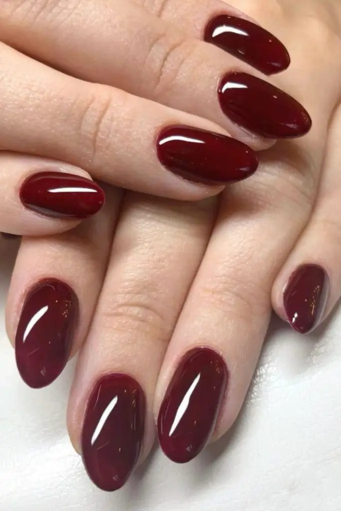 Sophisticated deep burgundy nails with high gloss.