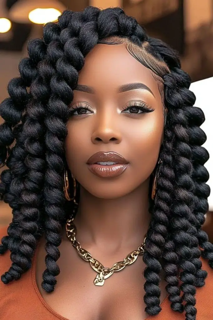 Volume-filled jumbo twists with a dramatic side part.