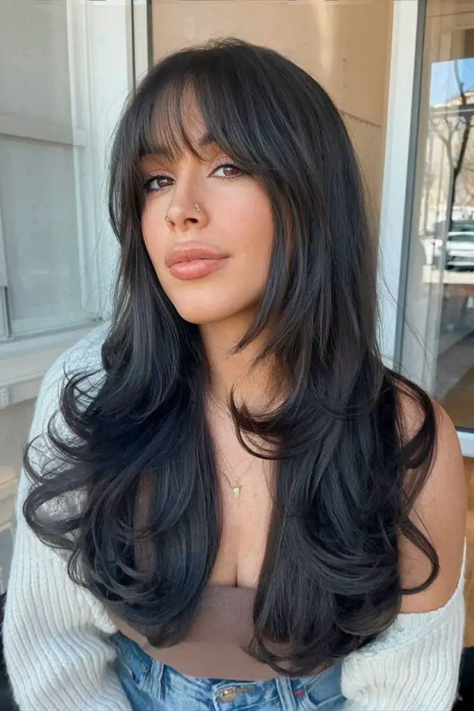 Long, voluminous bangs offering dramatic flair.