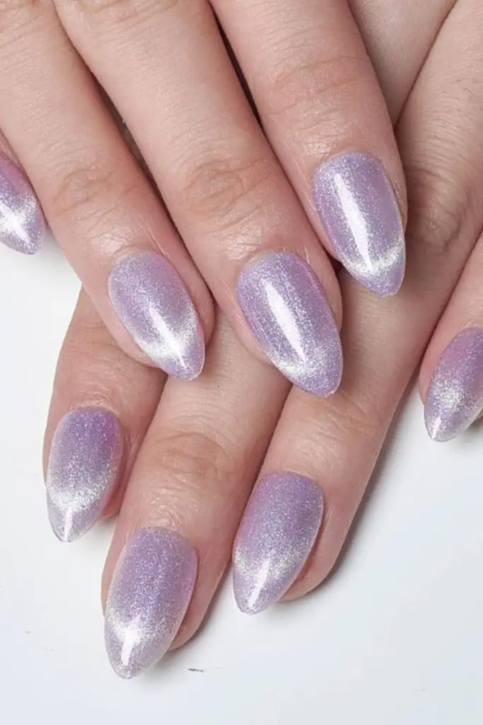 Gleaming silver oval nails with celestial charm.