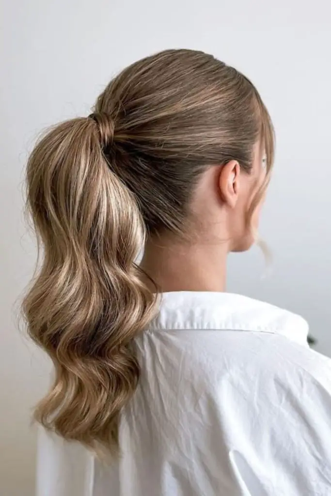 Stylish ponytail with sleek or messy look.
