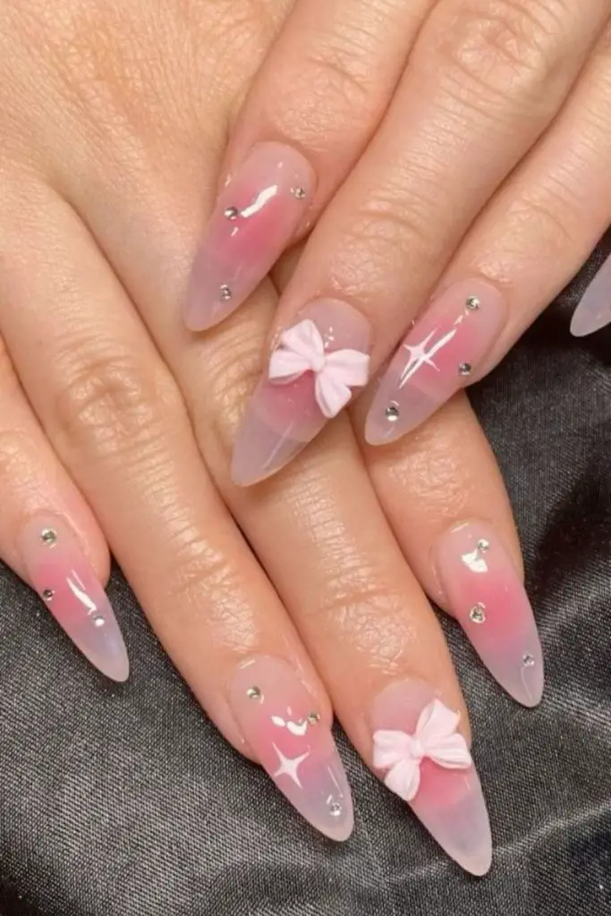 Soft pink nails with white dots.