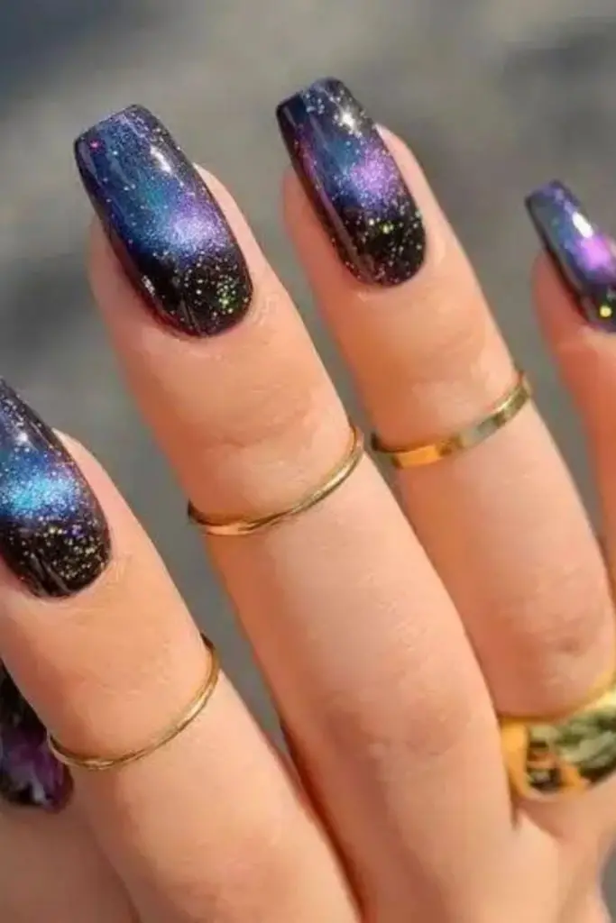 Metallic cosmic nails with stardust shimmer.