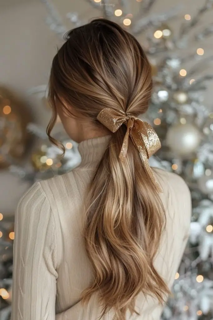 "Sleek low ponytail finished with a bow."