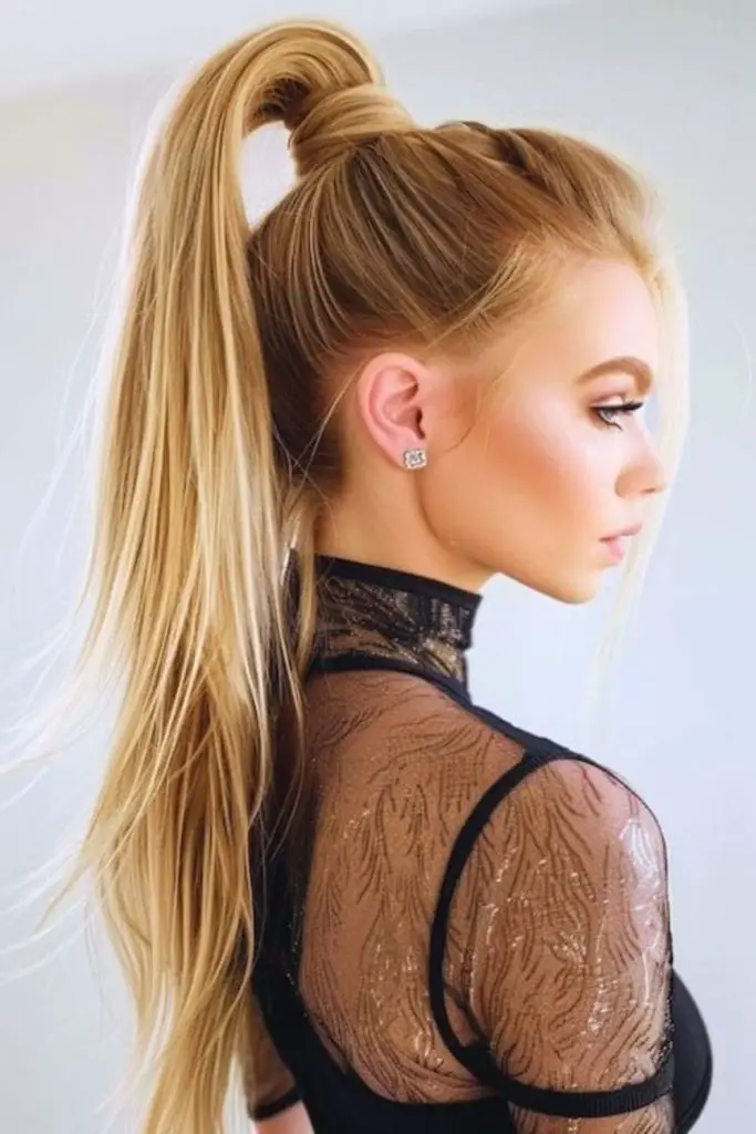 High ponytail with sleek volume and shine.