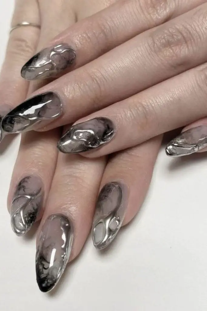 Smoky grey nails with geometric accents.